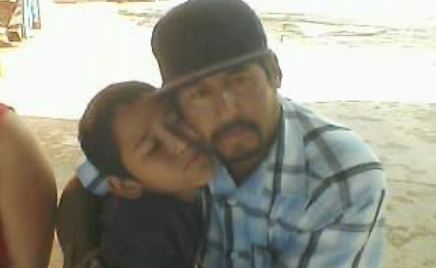 Beltran hugs his son, Jesus Adrian Urias Machado. Beltran was an experienced farmworker and traveled from Arizona to work in Nebraska.