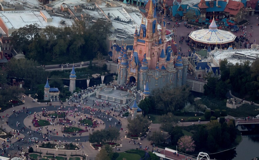 In an aerial view, Walt Disney World's iconic Cinderella Castle is seen on the grounds of the theme park this February. On Monday, Florida Gov. Ron DeSantis took control of Disney's special tax district.