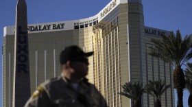 A Las Vegas police officer stands by a blocked off area near the Mandalay Bay casino, Tuesday, Oct. 3, 2017, in Las Vegas.