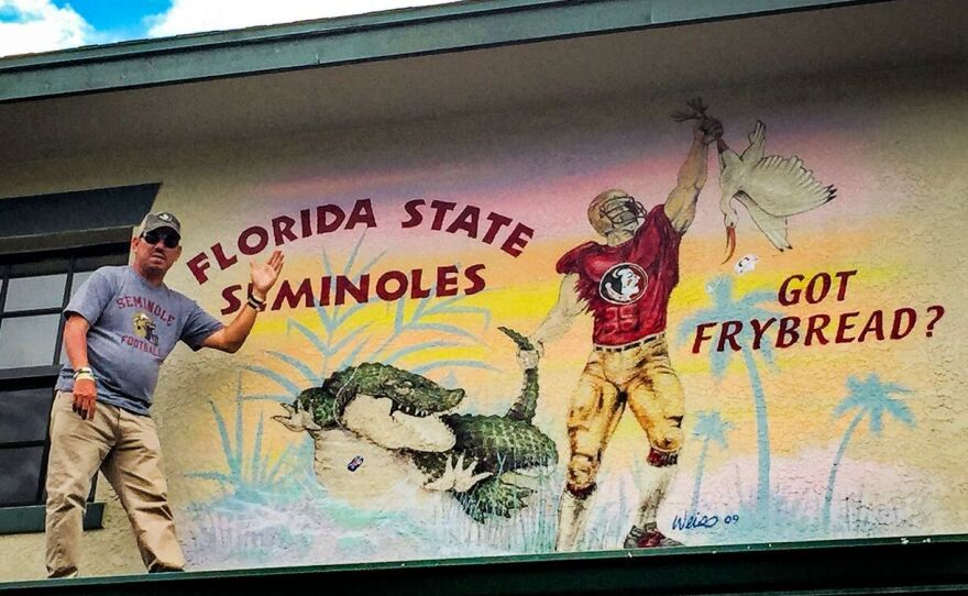 Skeeter Bowers, 48, is assistant to the chairman of the Seminole Tribe of Florida. He's so proud of FSU and Osceola that he has murals painted on his house on the Brighton Reservation, Okeechobee, Florida. This one shows FSU's dominance over the University of Florida Gators and the University of Miami Hurricanes. As for fry bread, it's a Seminole specialty.