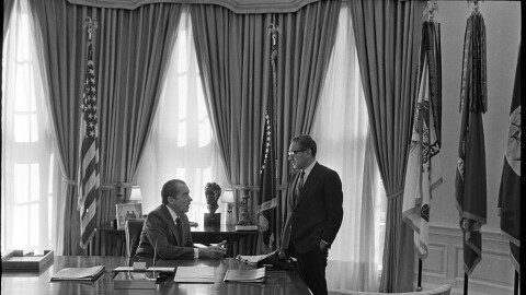 Feb. 10, 1971. President Nixon working with various staff members in the Oval Office, including H.R. Haldeman, Henry Kissinger, Herbert Klein, Clark MacGregor, Ron Ziegler.