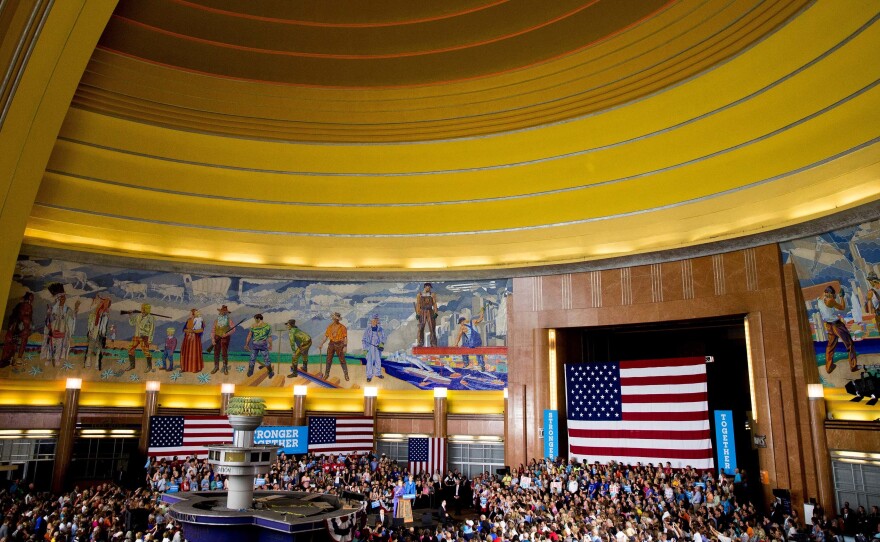 Democratic presidential candidate Hillary Clinton, accompanied by Sen. Elizabeth Warren, speaks at the Cincinnati Museum Center at Union Terminal on Monday.