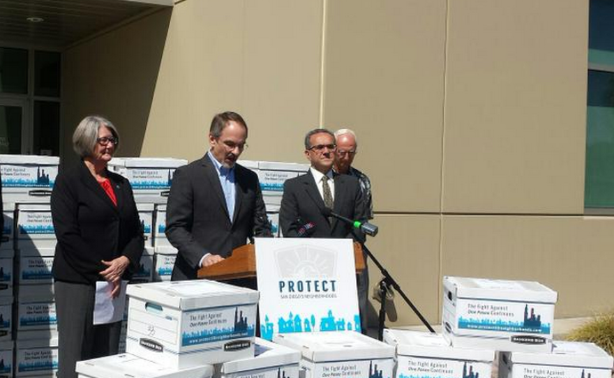 City Council President Sherri Lightner, Carmel Valley resident Ken Farinsky and San Diego Community Planners Committee Chairman Joe La Cava speak at a news conference before handing in signatures to block the City Council's approval of the One Paseo development, March 25, 2015.