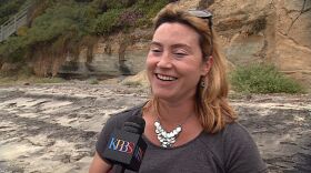 Angela Howe stands at the base of the Lynch seawall in Encinitas and talks about the homeowner's legal challenge to the California Coastal Commission's Authority, on June 8, 2015.