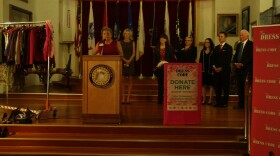 Holly Shaffner, public relations director with the San Diego Veterans Museum, stands with women veterans and city leaders to kick off a clothing drive for women veterans, Oct. 29, 2015.
