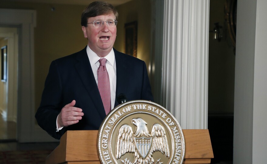 Mississippi Gov. Tate Reeves delivers a televised address prior to signing a bill retiring the last state flag in the U.S. with the Confederate battle emblem, during a ceremony at the Governor's Mansion in Jackson, Miss., on Tuesday. The legislation passed both chambers of the Legislature on Sunday.