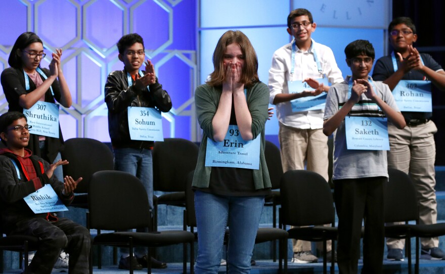 The Scripps National Spelling Bee is canceling its 2020 national finals, citing "uncertainty around when public gatherings will be possible or advisable." Here, Erin Howard, center, is cheered by her fellow co-champions during last year's finals in Oxon Hill, Md.