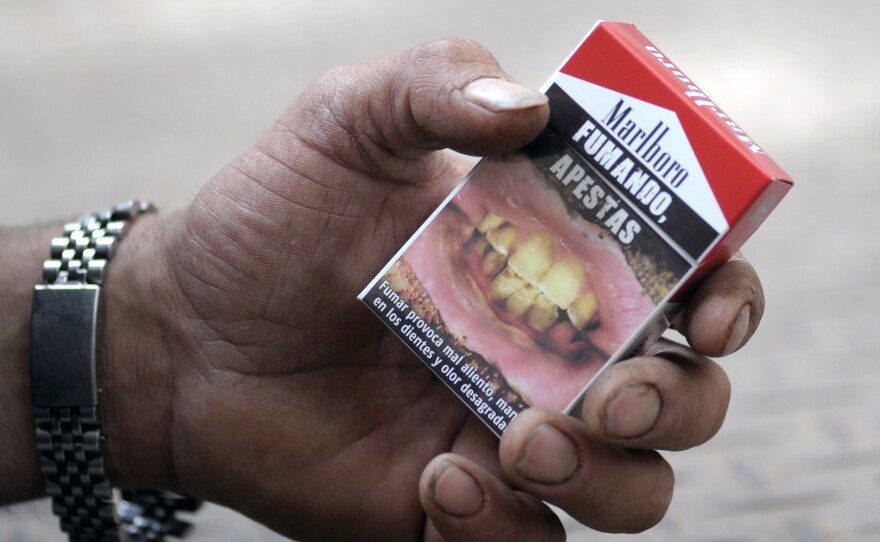 Fumando Apestas: A cigarette package in Montevideo, Uruguay, warns that "smoking, you stink."