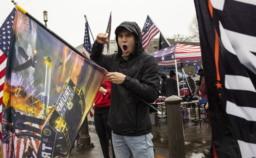 Seven Oregon counties have now voted in favor of a secession movement, which calls for leaving the blue state to join red-state Idaho. Here, a man yells at the Capitol in Salem on Jan. 6, protesting in support of former President Donald Trump.