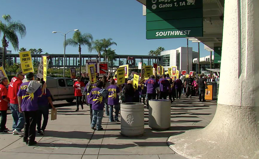 Fight for 15 protesters march at San Diego International Airport, Nov. 29, 2016.