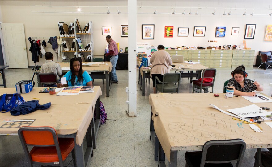 Artists work in the Art Enables studio and gallery in Northeast Washington, D.C., on a Monday afternoon in June.