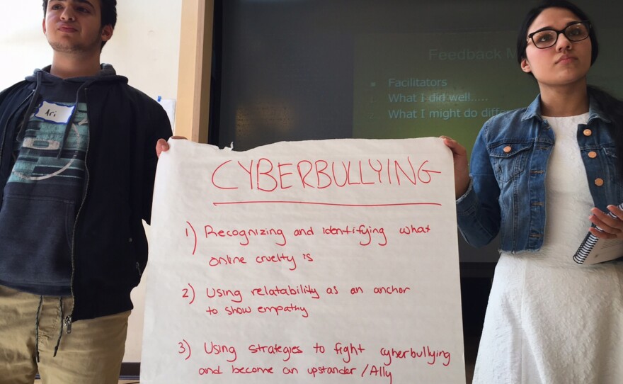 Brookline High School students Ari Lazowski (left) and Iman Khan practice presenting an exercise on cyberbullying.