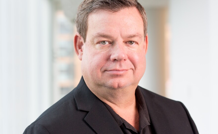 Wade Goodwyn reported for NPR for three decades and was known for his deep Texas bass and keen reporting observations and sharp writing. He's pictured here at NPR headquarters in Washington, D.C., in 2018.