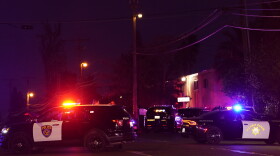 Law enforcement vehicles from several agencies block a street near the scene of a shooting in Sacramento, Calif., on Monday.