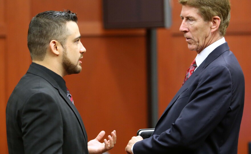 Robert Zimmerman Jr. (left) speaking with defense attorney Mark O'Mara during a pre-trial hearing in May.