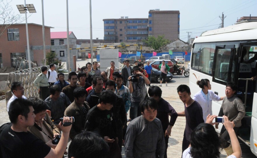 Chinese fishermen — detained for 13 days by North Korea — return to Dalian, in northeast China's Liaoning province, May 21.