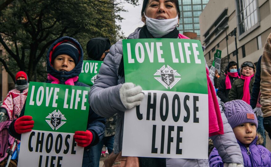 Anti-abortion demonstrators participate in the Texas March for Life on January 15, 2022 in Dallas, Texas.