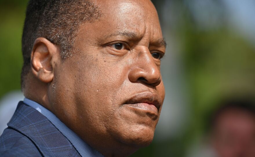 Conservative talk show host and gubernatorial recall candidate Larry Elder speaks to the media after casting his ballot Wednesday in Los Angeles.