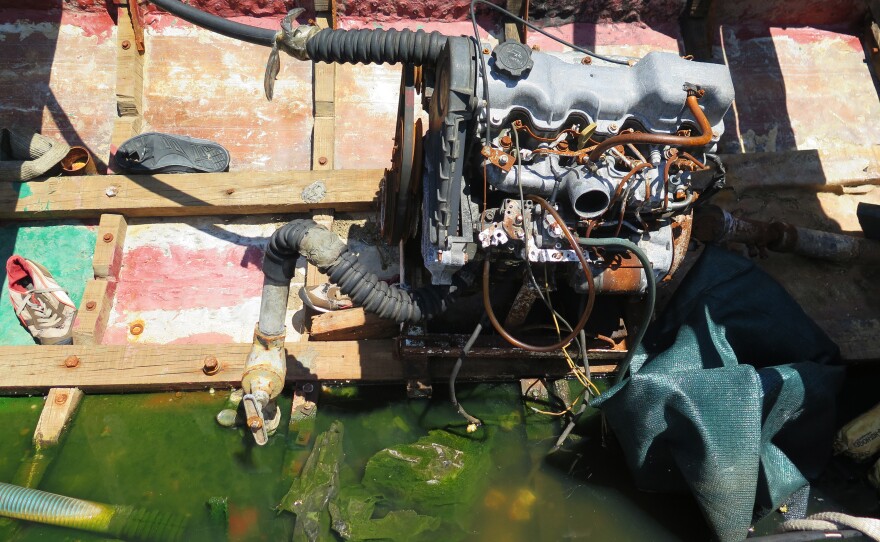 The interior of a "chug" shows the engine along with sneakers and other debris from the migrants' trip.