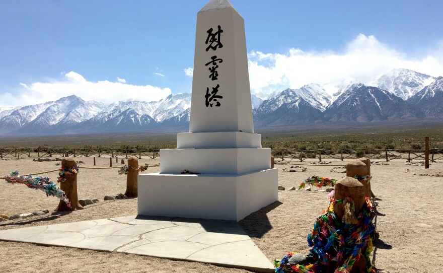 The Manzanar cemetery includes a white obelisk monument in the midst of a wide clearing, making it feel lonely.