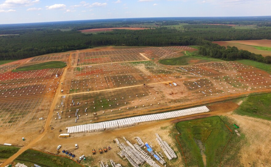 An aerial view of the construction site for Silicon Ranch's new solar farm. The company is building around existing ponds and wetlands and will keep a vegetative barrier so that the solar panels will not be visible from the road.