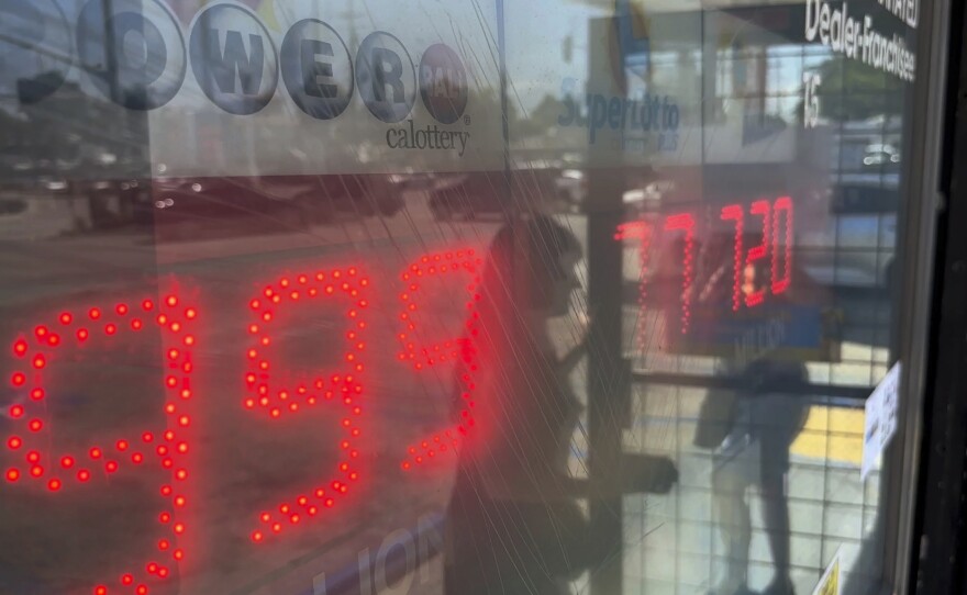 People buy Powerball tickets at Joe's Service Center, a Mobil gas station that previously sold the $2.04 billion-winning Powerball ticket at Woodbury Road and Fair Oaks Avenue in Altadena, Calif., Wednesday, July 19, 2023.
