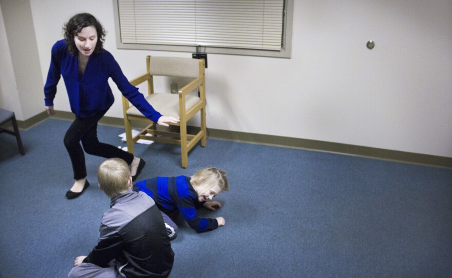The improv theater class at Indiana State University's psychology clinic. Rachel Magin (standing) created the class to help children with autism learn social skills and practice reading others' emotions.