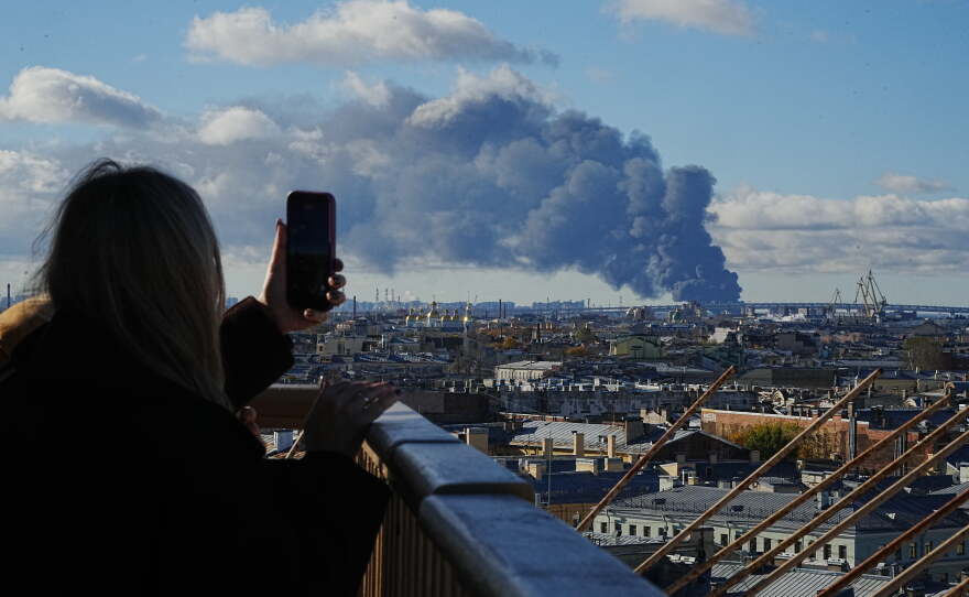 Smoke billows into the sky following Ukrainian drone strikes on an industrial zone in St. Petersburg, Russia, on Sunday, Oct. 18, 2026.