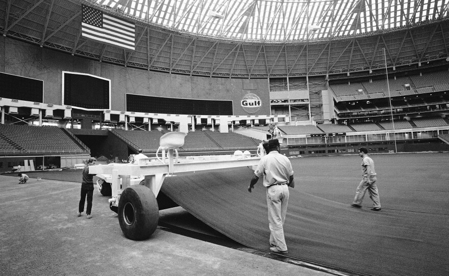 Grass is being replaced with Astroturf in the Astrodome on July 25, 1966. Previously, the field was covered with grass that dried out under the dome.