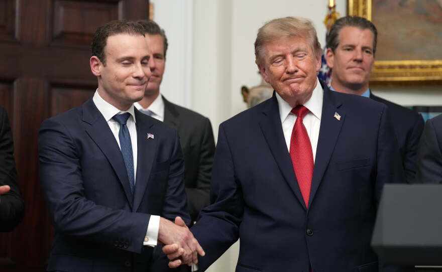 President Donald Trump shakes hands with Commodity Futures Trading Commission (CFTC) Chairman Michael Selig during a meeting with technology leaders in the Roosevelt Room of the White House, Wednesday, Aug. 19, 2026, in Washington.