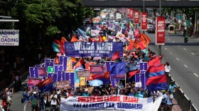 Protesters march during a rally by transport workers and activists protesting the rise in oil prices on Friday, March 27, 2026, near the Malacanang presidential palace in Manila, Philippines.