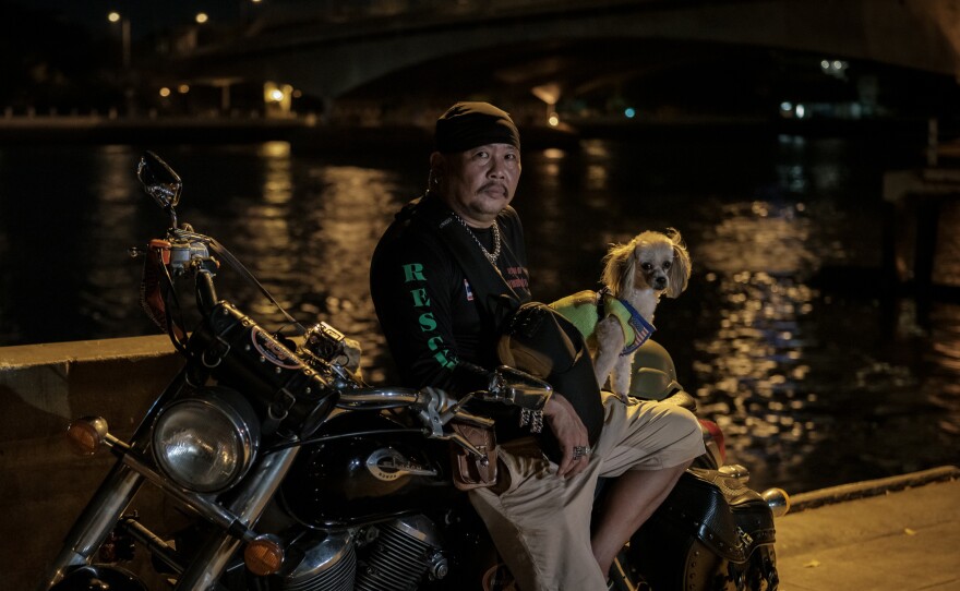 Suchart Prasomsu, 53, leads a rescue team of 30 volunteers in Bangkok, using his Harley to get to car crashes and crime scenes. Since the start of the pandemic, they've also been called on to try and keep people from killing themselves.