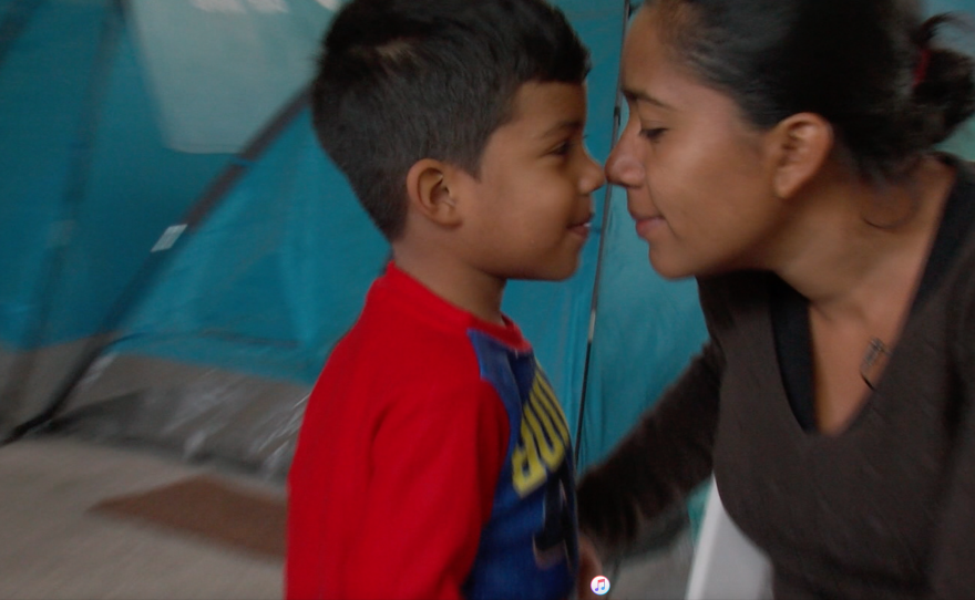 Olivia Caceres and her son Andree play in a migrant shelter in northern Mexico, Nov. 4, 2017.