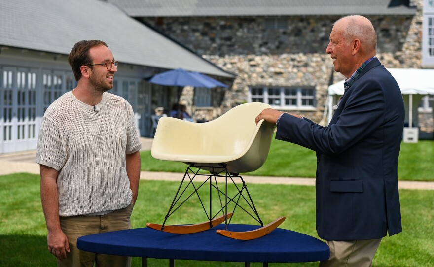 John Sollo (right) appraises a 1960 Charles & Ray Eames rocking chair in Charlevoix, Mich. ANTIQUES ROADSHOW “Castle Farms, Hour 3” premieres Monday, April 13 at 8/7C PM on PBS.