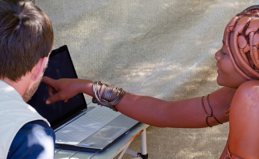 A woman from the Twe tribe tests her ability to mentally rotate an item on a laptop computer. In the battle of the sexes, researchers in the Namibia study found men to be the better mental rotaters.