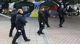 Oakland police officers patrol the Occupy Oakland encampment on November 12, 2011 in Oakland, California.