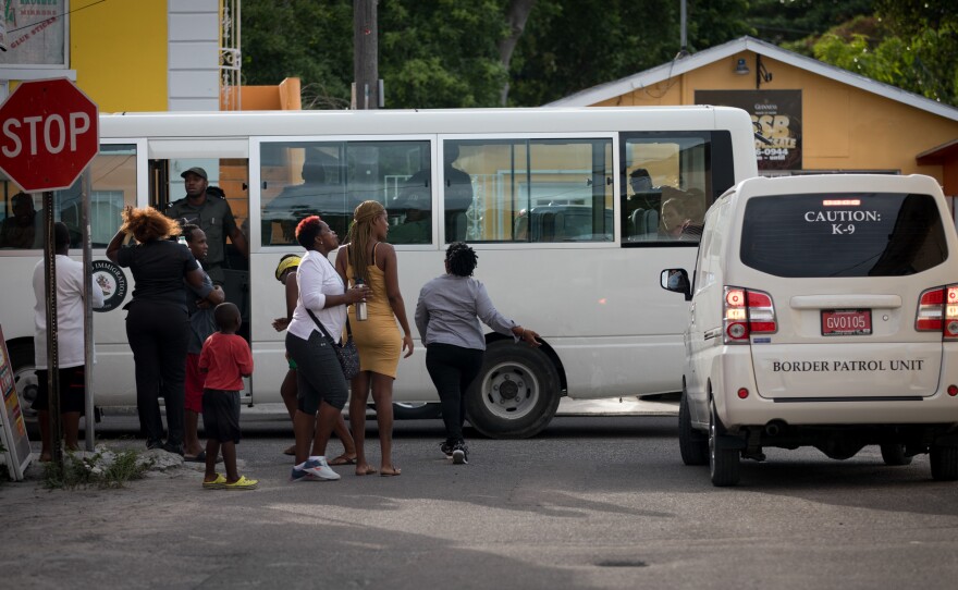 The border patrol rounds up undocumented Haitian immigrants in Nassau on Sept. 30. Two days later, Prime Minister Hubert Minnis announced that Haitians in the Bahamas without documentation would be deported.