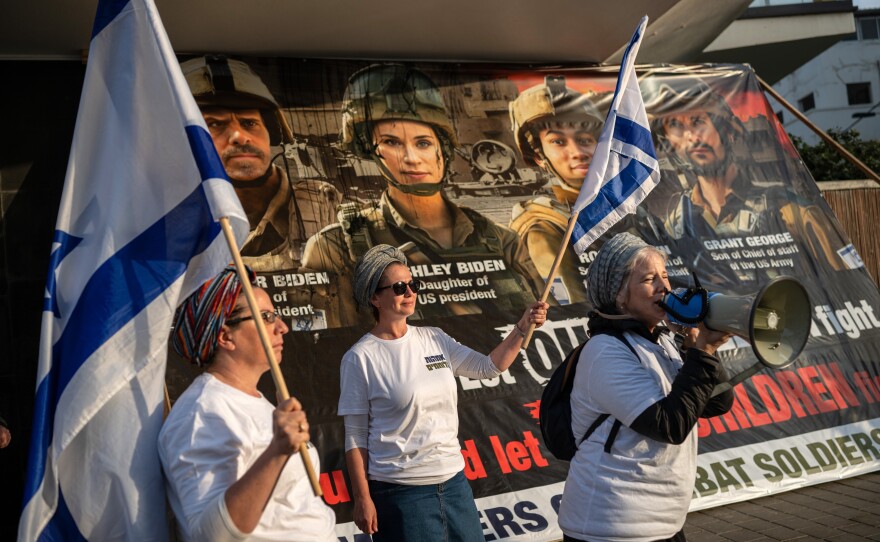 Rina Shamir, whose son and husband are serving in Gaza, speaks during a small demonstration in Tel Aviv supporting the war, during U.S. Secretary of State Antony Blinken's visit to the region on Jan. 9.