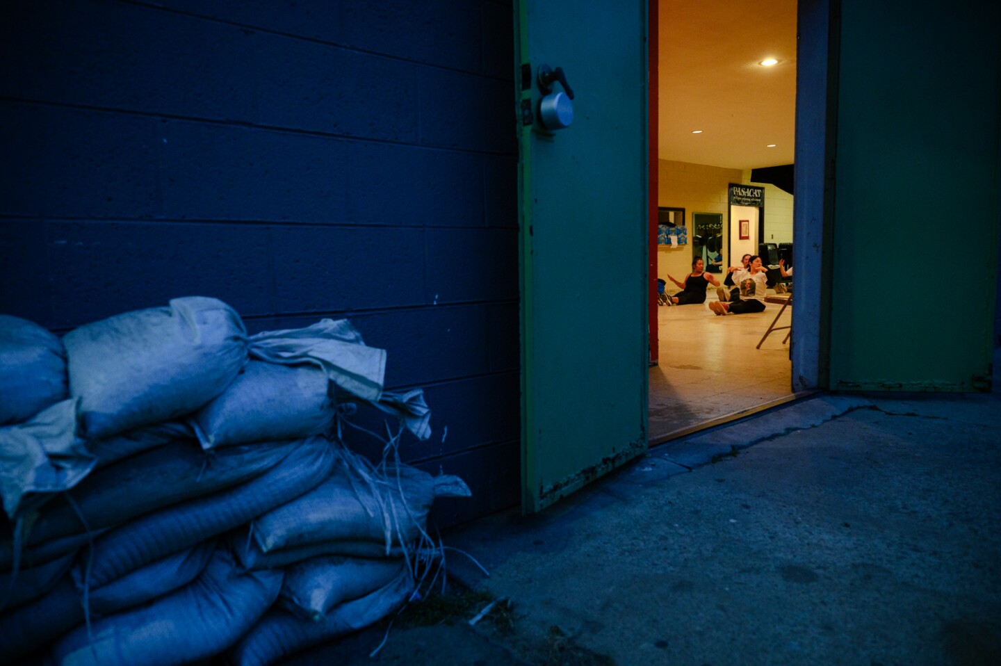 Sandbags rest outside of the PASACAT studio building in National City on April 23, 2024. The renowned Philippine arts company has faced years of flooding but hopes to build back stronger this time.