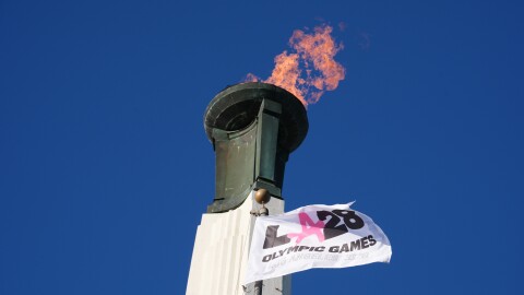 The Olympic cauldron is lit at the Los Angeles Memorial Coliseum in January ahead of ticket registration. The IOC's new policy takes effect for the 2028 Summer Games.