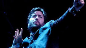 Performance photo of musician Bob Schneider. 
