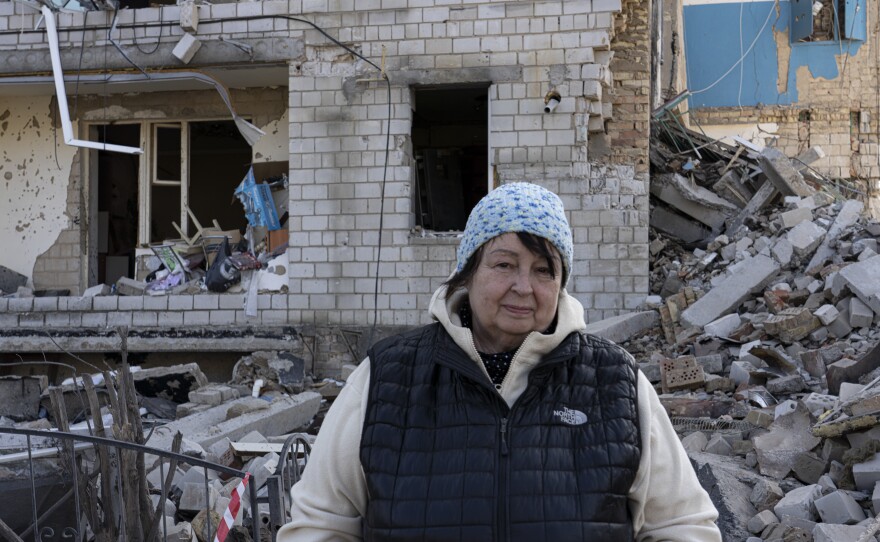 Ludmila Boiko near a collapsed building in Borodyanka.