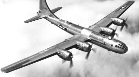 Black and white photo of a B-29 in flight. 