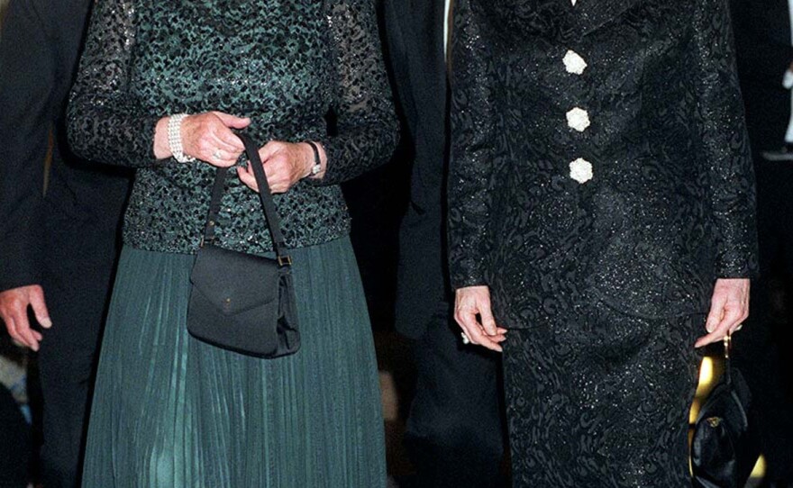 Britain's Queen Elizabeth II (L) and former British Prime Minister Thatcher arrive 16 October 1995 at Claridge's in London for a dinner to celebrate the former Prime Minister's 70th birthday. Baroness Thatcher greeted the Queen warmly, laying to rest past speculation that the two women did not get on with each other.