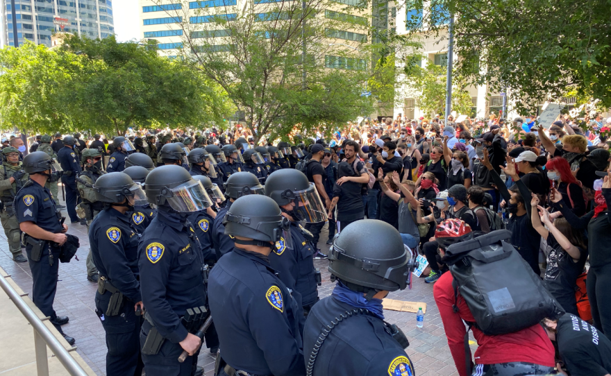 Police and protesters face off in downtown San Diego, May 31, 2020.