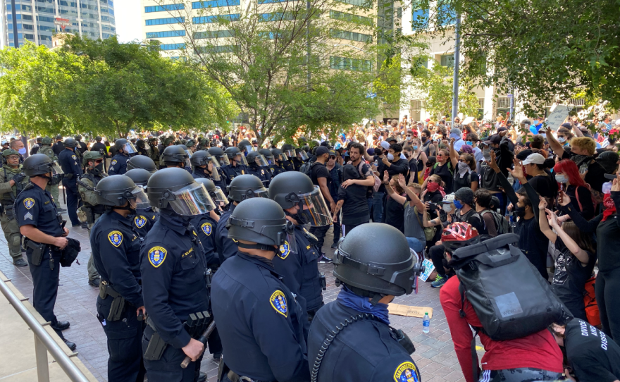 Police and protesters face off in downtown San Diego, May 31, 2020. 