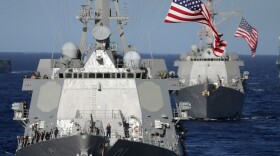 The guided-missile destroyers USS Pinckney (DDG 91) and USS Shoup sail in formation off the coast of Hawaii.
