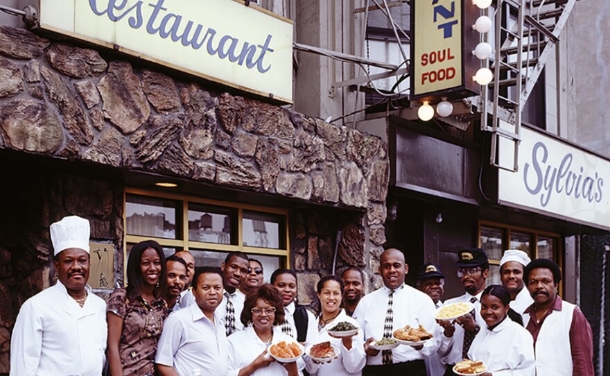 Sylvia Woods and her employees outside Sylvia's restaurant, a legendary soul-food restaurant in Harlem.