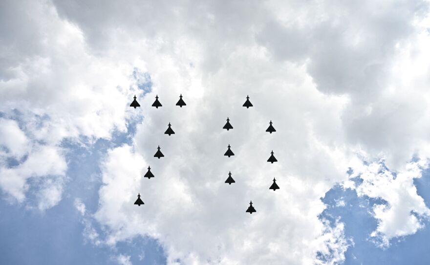 Fighter jets from Britain's Royal Air Force fly in formation to form the number 70 over a Buckingham Palace balcony following the Trooping the Color parade, as part of Queen Elizabeth II's Platinum Jubilee celebrations.
