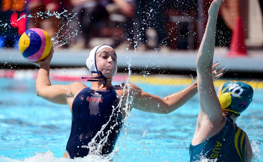Maggie Steffens of the United States (left) launches out of the water as she shoots during the 2016 Olympic team trials in Los Angeles on May 22.